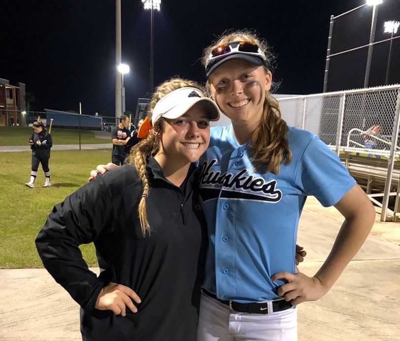 Hagerty+and+Oviedo+students%2C+Zoe+Thornsbury%28right%29+and+Ava+Bassani%28left%29+take+pictures+together+after+their+game.+The+Hagerty+varsity+softball+team+beat+Oviedo+5-1.+
