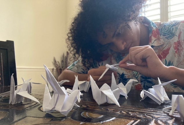 Senior Hamza Zeini folds origami cranes at home, that will count as service hours towards the Asian Culture Club. The club will be donating these to the Children’s Peace Monument in Hiroshima, Japan.