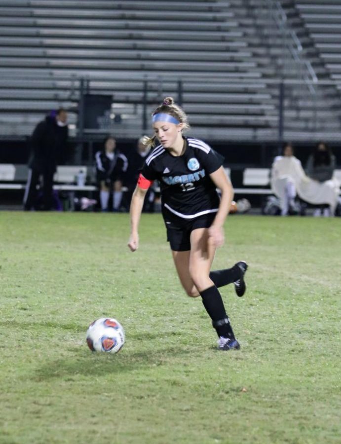 Foward Emma Canty dribbles the ball downfield versus Winter Springs.