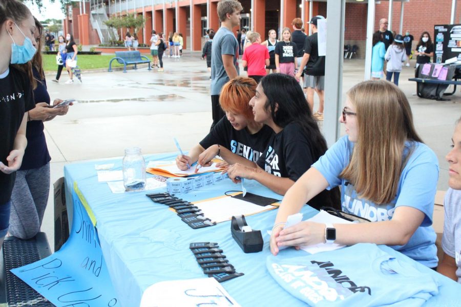 Student government officers sell class t-shirts at the Aug. 4 Club Crawl. Elections for the upcoming school year will be held on Sept. 2 and 3.