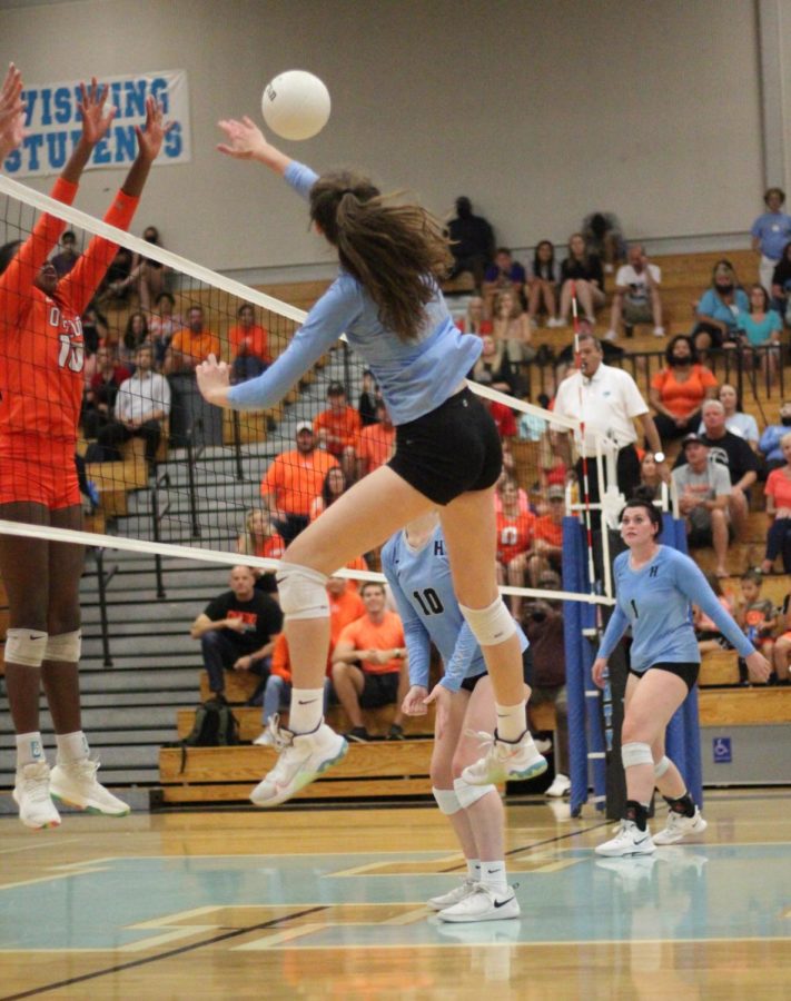 Outside hitter Brooke Stephens spikes the ball. The girls varsity volleyball team won against Oviedo.