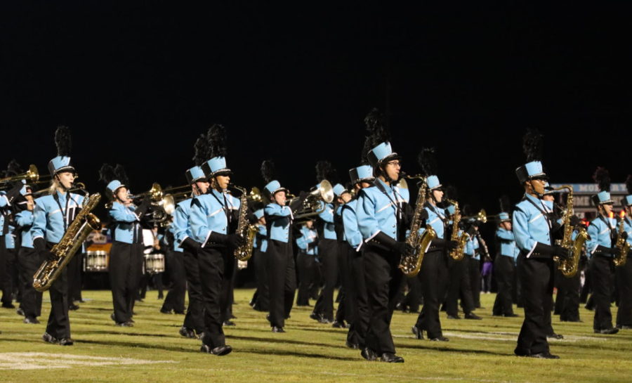 The marching band performs on the home field during the Winter Springs half time. The band returned to the home field on Sept. 10 for the first time in two years and played a compilation of Queen songs.