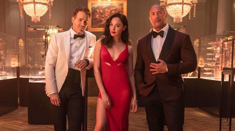 Released on Netflix Nov. 5, Red Notice follows John Hartley (Dwayne Johnson) and Nolan Booth (Ryan Reynolds) team up to stop The Bishop (Gal Gadot). 