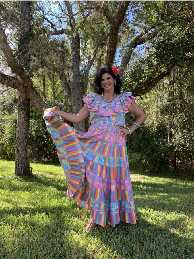Ariza poses for a photo with her folkloric dress. In her Spanish classes, Ariza likes to sing and cook traditional foods as a way to expose her students to different cultures.