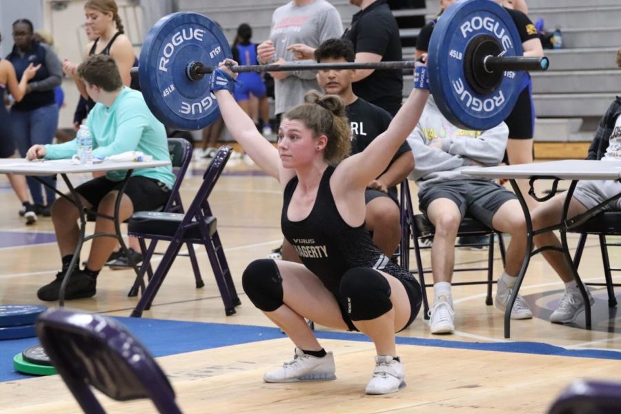 Senior Hali Fildes is in the middle of her snatch lift. Fildes went on to place first at states for snatch. 