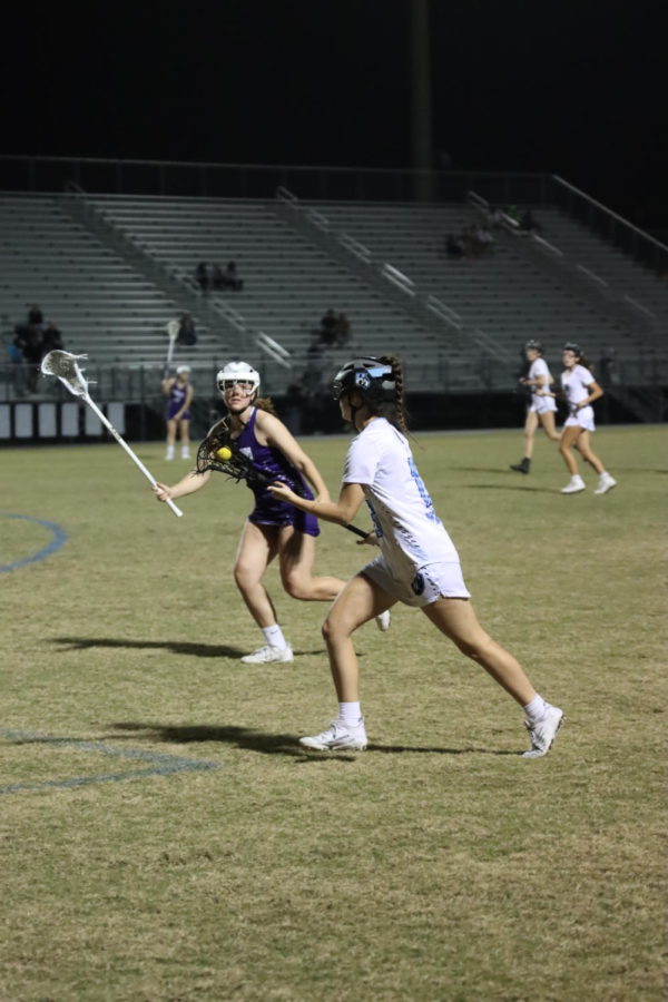 Ainsley Pomp runs down the field with the ball. The team won against Timber Creek in the regional quarter final game.