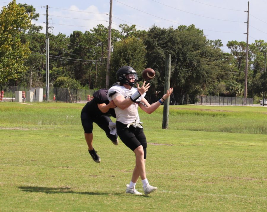 Wide receiver Caleb Barber catches the ball in practice. The teams next game is against university orange on Aug. 26.