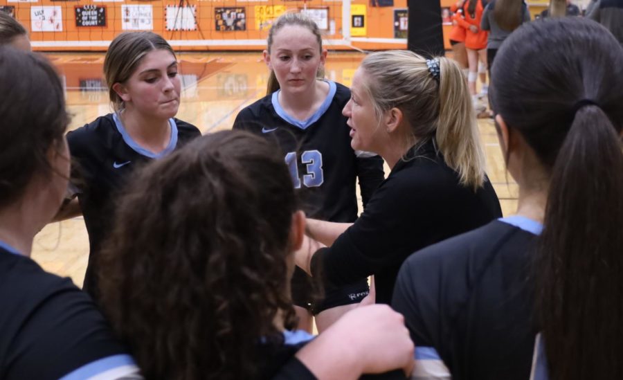 Varsity coach Juanita Hitt talks to setter Emma Greenier during a Hagerty timeout. Hagerty fell to a 3-2 loss against Oviedo.