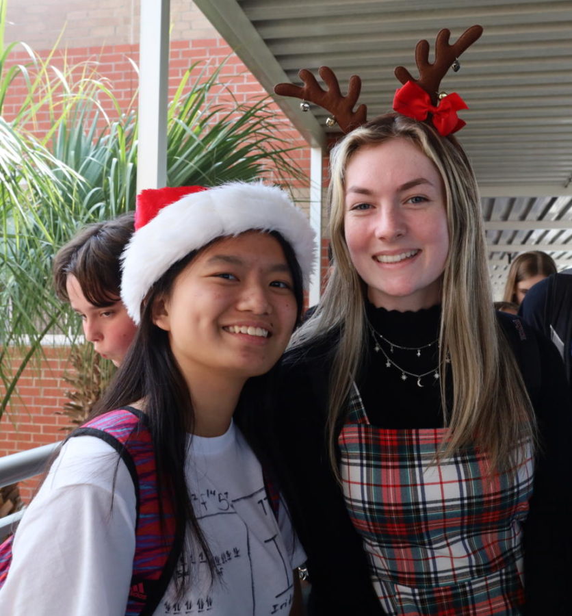 Sophomores Josephine Lim and Macy Drewry dress up on Thursday with holiday accessories. This was one of five dress up days throughout the week. 