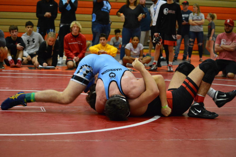 Senior Kamden Harrison pins his opponent from Satellite Beach. Harrison took second place in the 160 weight class. 