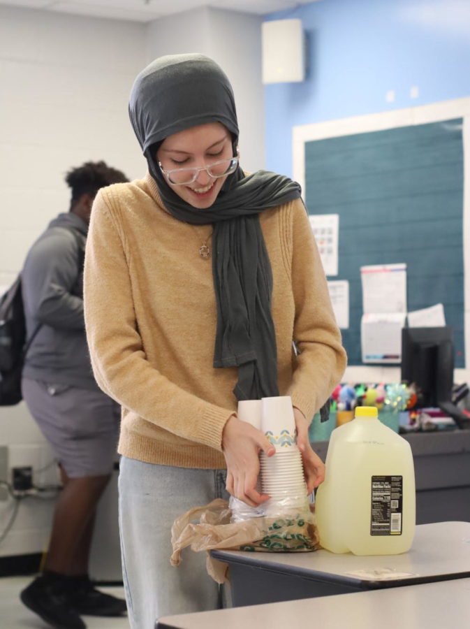  President Mariam Al Lebban sets out cookies and lemonade at the Muslim Student Association’s interest meeting on Jan. 12. The group was started “to educate people about Islam and derail the misconception,” vice president Zahra Ateeq said.