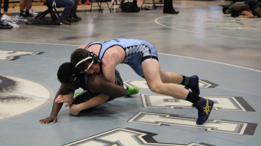 Senior Kamdon Harrison is about to breakdown his opponent. Harrison won this match by pin. 