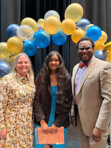 Junior Anouska Seal poses with administrators Angie Campbell and Reginald Miller to celebrate her win at the Seminole County Science Fair. 