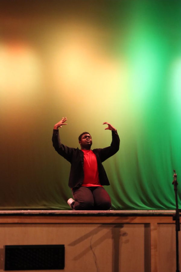 Senior Jamason Belgrave dances passionately as one of the first acts in the Black Student Unions first inaugural Black History Month showcase. The event is the first of its kind held by the organization.