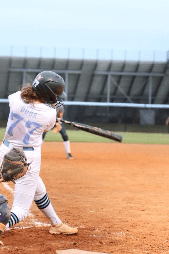 Senior Bennett Duba hits one of her two doubles in the bottom of the third inning against South Lake. Duba was a top performer in the varsity softball teams big 12-2 win.