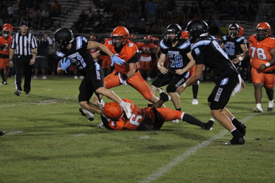 Wide Receiver Franco Jimenez gets tackled after a short class. The team would tie against Lake Toho 14-14.