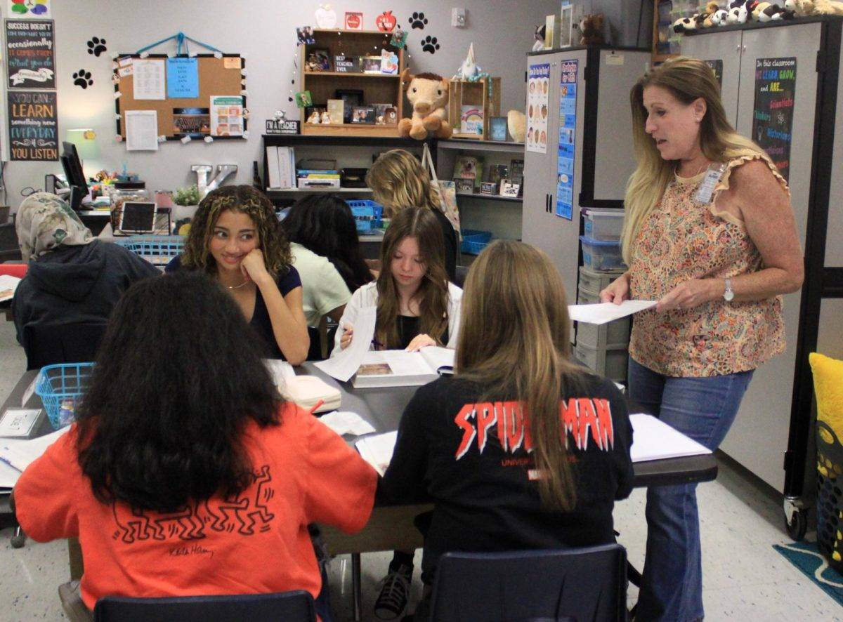 Early Childhood Education teacher Kristen Kidd helps students with individual instructions. After teaching at Hamilton and Geneva elementary schools for 22 years, Kidd now joins Hagerty staff to teach entry ECE courses.