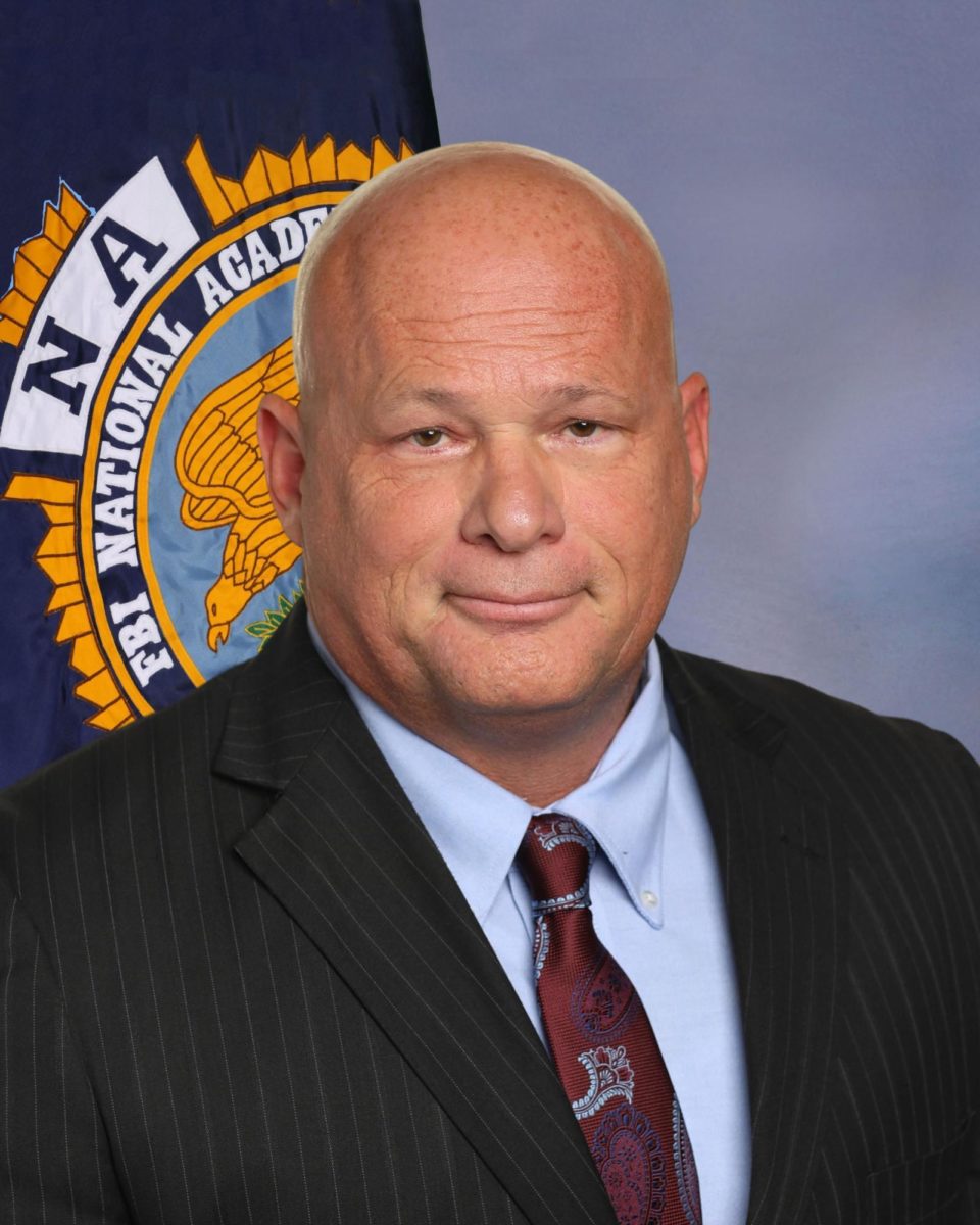 Chief Francis smiles for his graduation photo from the FBI National Academy. Fewer than 1% of law enforcement officers have the opportunity to attend the program, and Francis describes the experience as a check off his professional bucket list.