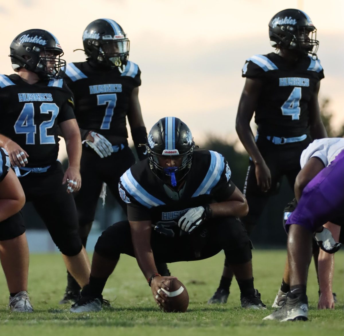 Center Jaymen Patel gets ready to snap the ball. The varsity football team won against Timber Creek 14-10.