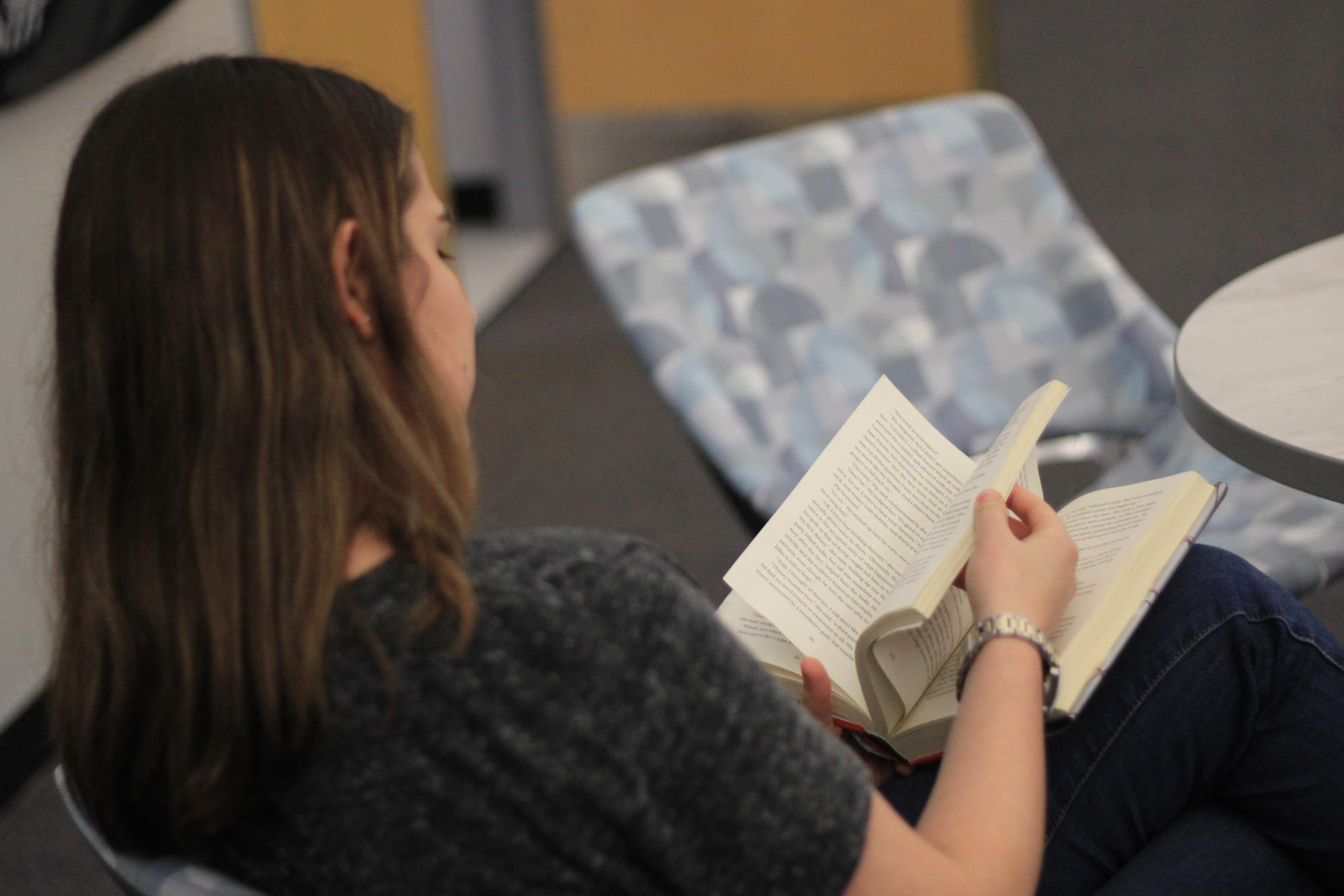 Sophomore Sofia Azevedo reads A Good Girls Guide to Murder, which she checked out at the Teen Book Tasting. The Oviedo Library sometimes holds teen events for high schoolers to discuss and read books.