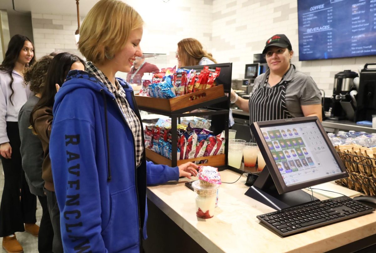 Sophomore Bailey Helwig orders a strawberry parfait at the new café, Filtered.  The café lines have been very long due to the popularity of the new micro-restaurant.