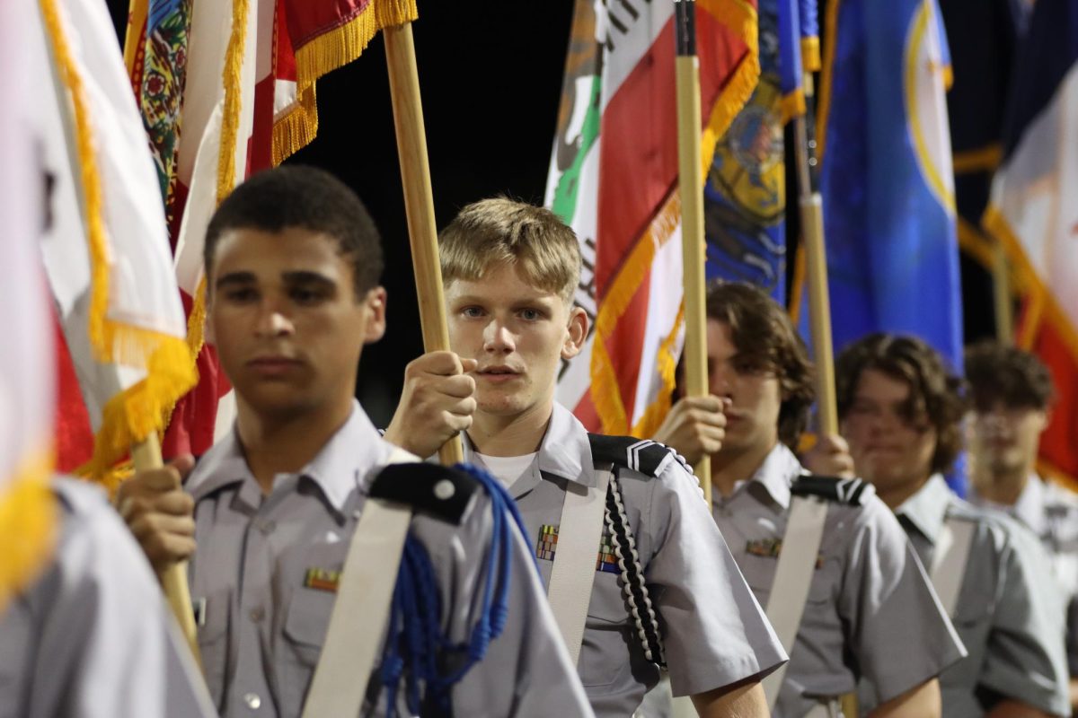 JROTC students carrying flags at the homecoming court ceremony. the aeronautics course will be run through JROTC.  