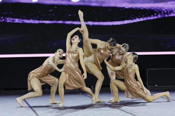 Members of Hagertys varsity dance team, Unleashed, dancers hold onto each other next week. This is the second time the Unleashed Dance Team has won, as the 2022 team also was awarded a national title