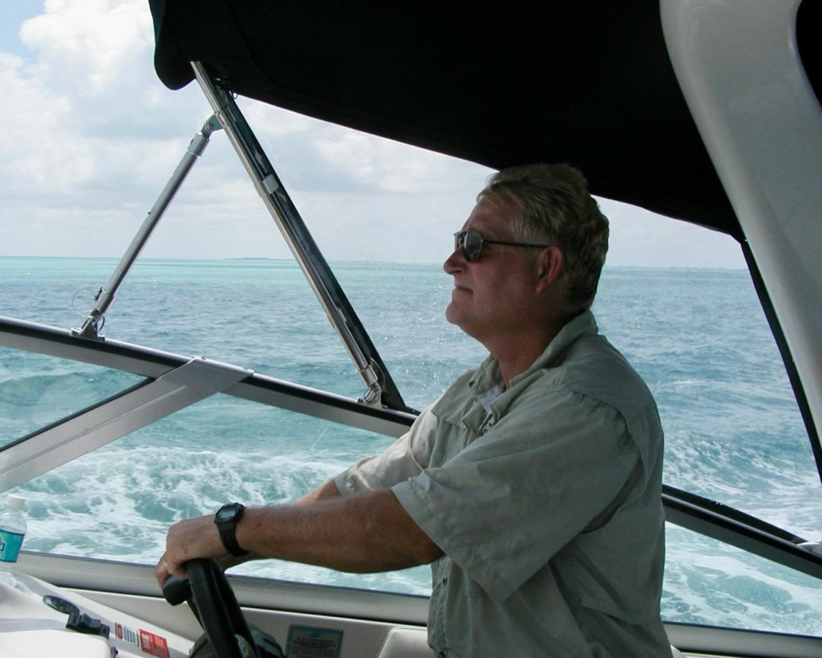 Haibel drives a boat and looks across the water. At his Celebration of Life ceremony, his favorite songs, consisting of primarily Jimmy Buffet, were played in his memory.