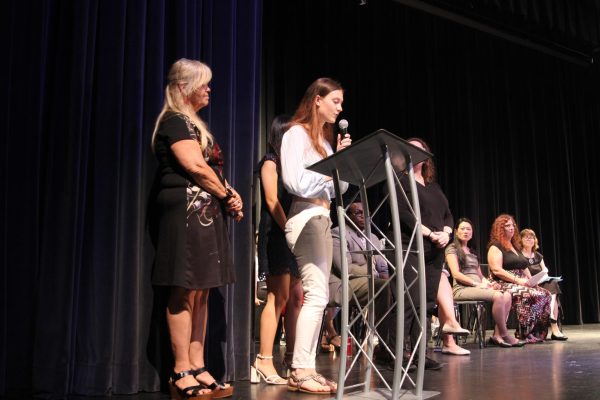French Honor Society secretary Lauren Bliss names inductees to get their certificate and sign their respective book. Hagerty’s 18th annual language induction was held at the auditorium from 6:30-7:30p.m. 
