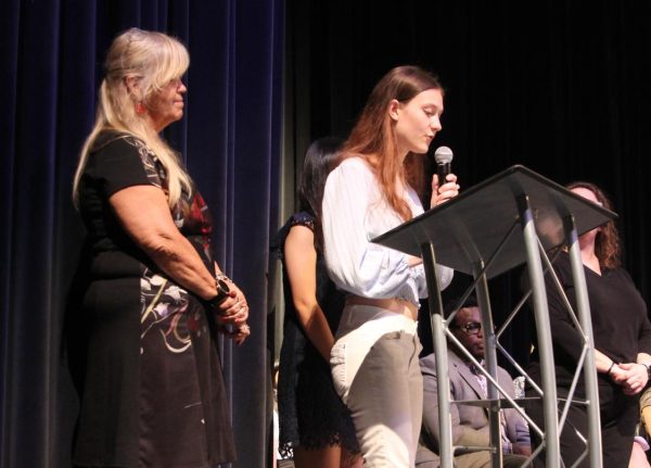 French Honor Society secretary Lauren Bliss names inductees to get their certificate and sign their respective book. Hagerty’s 18th annual language induction was held at the auditorium from 6:30-7:30p.m. 

