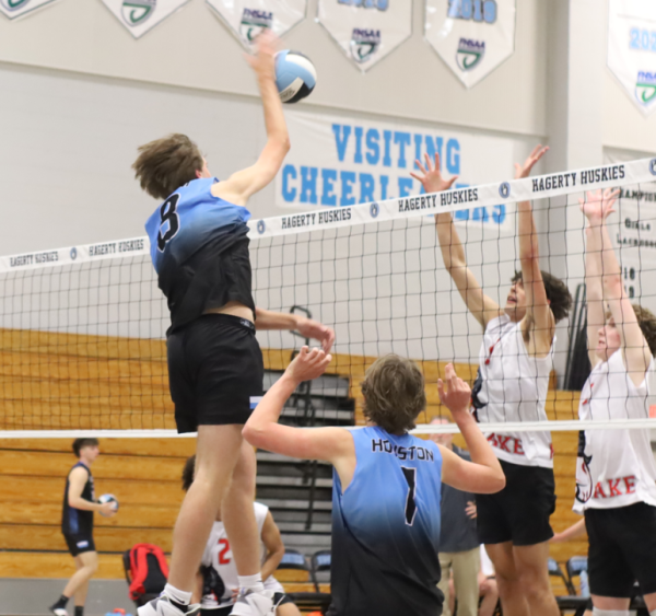 Setter Caden Houston sets up middle blocker Kellen Woolm to hit the ball. Houston consistently fed Woolm throughout the night.