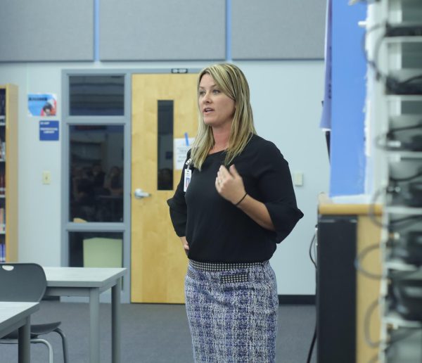 College and Career counselor Andrea Fuhrer introduces the College and Career Center to parents. The PTSA meeting took place Aug. 20 at the media center, various opportunities like college workshops, financial aid night and college tours are scheduled to occur throughout the school year. 