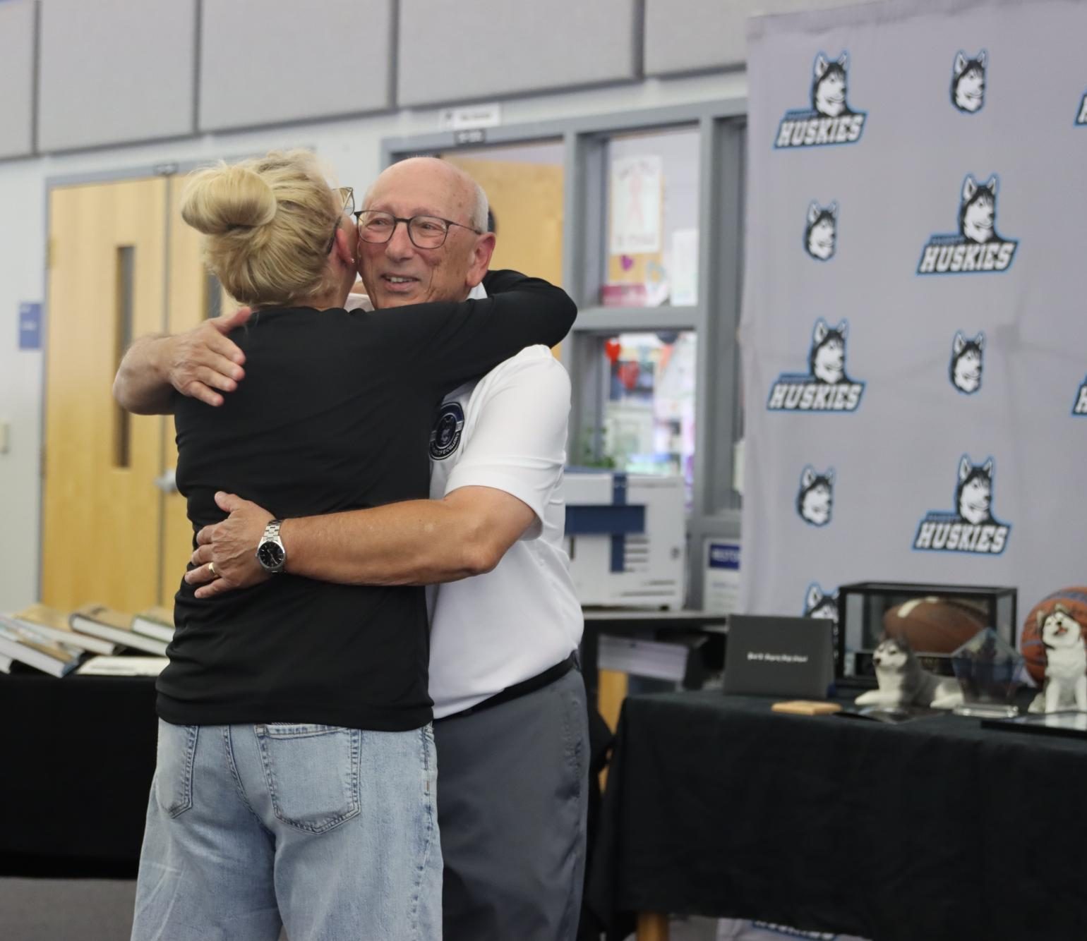 Sam Momary and calculus teacher Carolyn Guzman share a hug as they reunite. The dinner was part of many events to come as Hagerty celebrates its 20th anniversary.