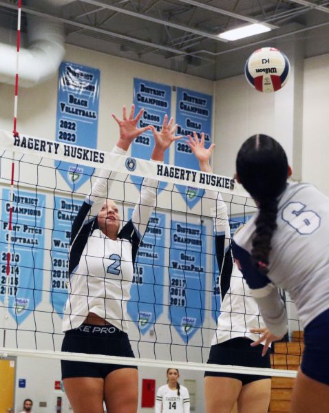 Setter Brielle Mullen attempts to block Lake Howell. She contributed three throughout the game. 