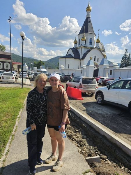 Svetlana Jacobs and her daughter, senior Aleena Jacobs, pose in front of a cathedral in Krasnoyarsk, Russia. Svetlana makes the effort to bring Aleena to Russia every few years to keep her connected to her roots.