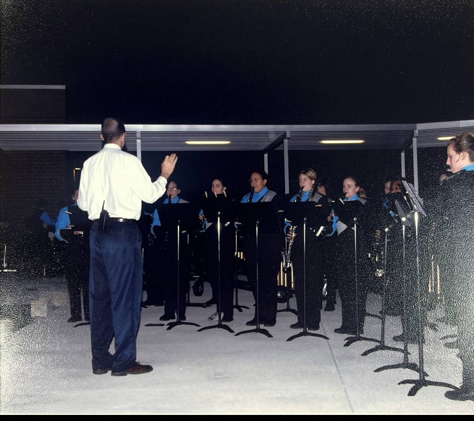 Mr. Mike Rice directs the band at Hagerty's ribbon cutting event. He returned to direct the band during the football against Lake Howell as part of the 20 year festivities. " It brings back so many memories. Just thinking about the times we got together, the traditions, and just seeing the uniform, all this excitement, it's awesome," Rice said. 