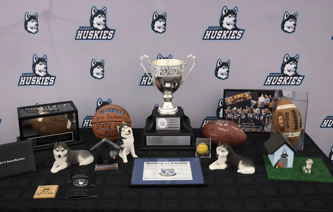 The SAC trophy, balls signed by state champion teams, and other accolades stand on display at the 20 year celebration held in the media center. Many more awards lie in other areas of campus for all sorts of extracurriculars. 