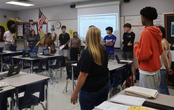 Teacher Amy Bingham leads an academic circle to discuss significant people throughout history. The use of circles required by new school policy.

