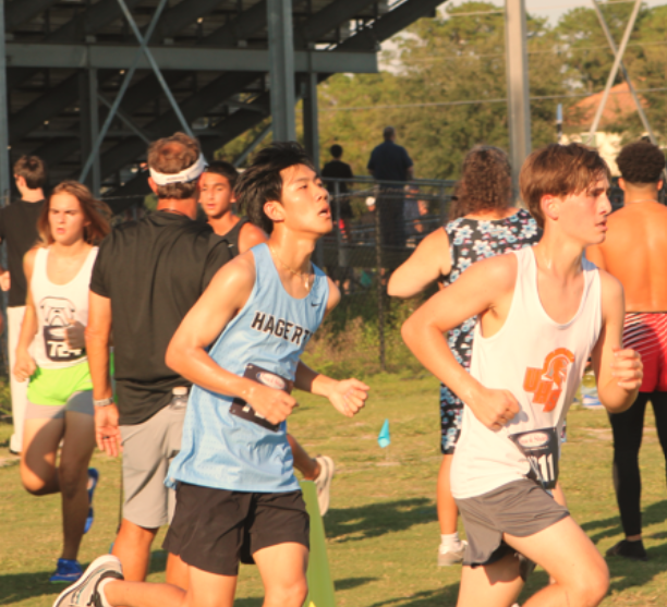 Senior runner Tyler Yun running his first lap of the race. Yun finished with a time of 26:56.30.
