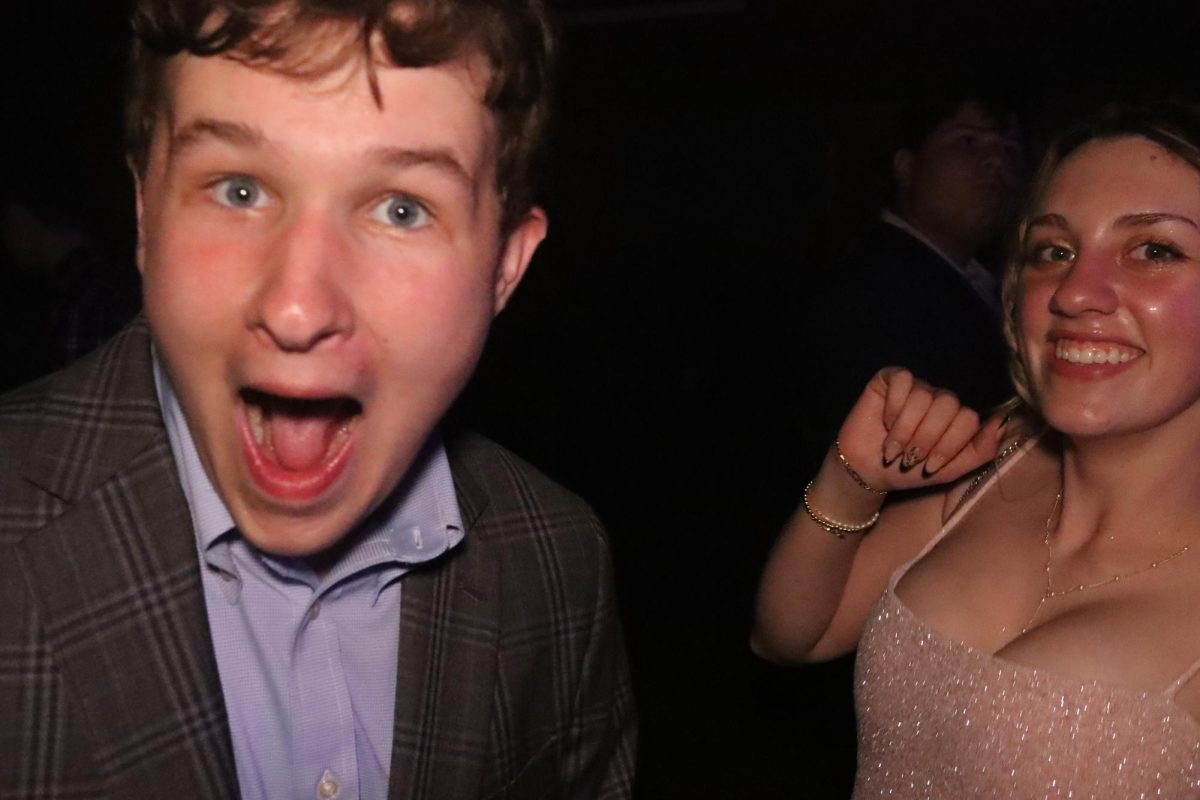 Students pose during the homecoming dance. Homecoming is the main event of the year for all students to have fun with friends, dance and sing along to the DJ.