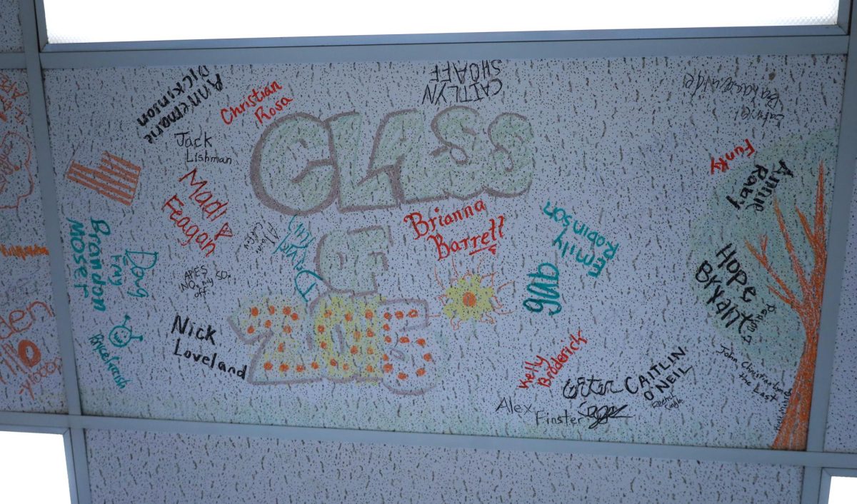 Amy Bingham has different tiles dedicated to classes of students in her classroom. This tradition allows students to get a look back into graduated classes. 