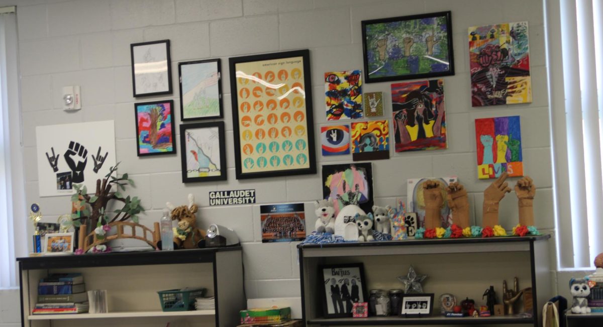 Trophies and student work sit at the center of ASL teacher Grace Wilken-Yoder's classroom. Many teachers proudly display student work in their classrooms.