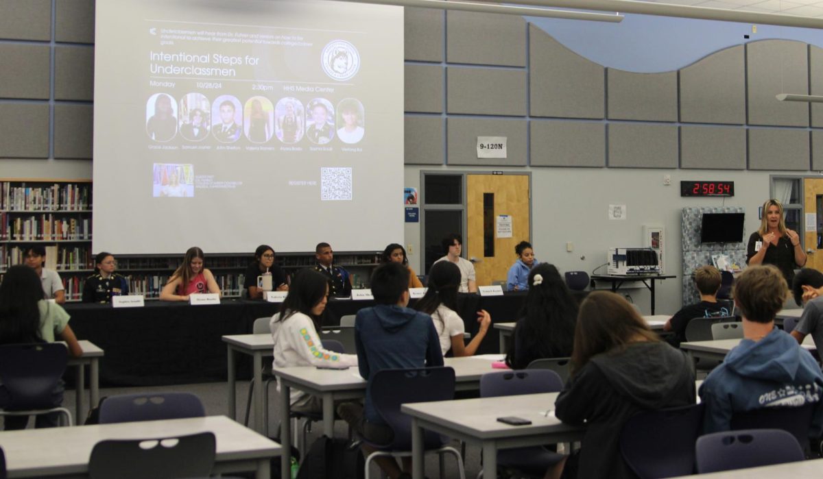 Dr. Andrea Fuhrer introduces senior speakers during the Intentional Steps seminar. Fuhrer chose the eight to share steps they took that enabled their successes. 