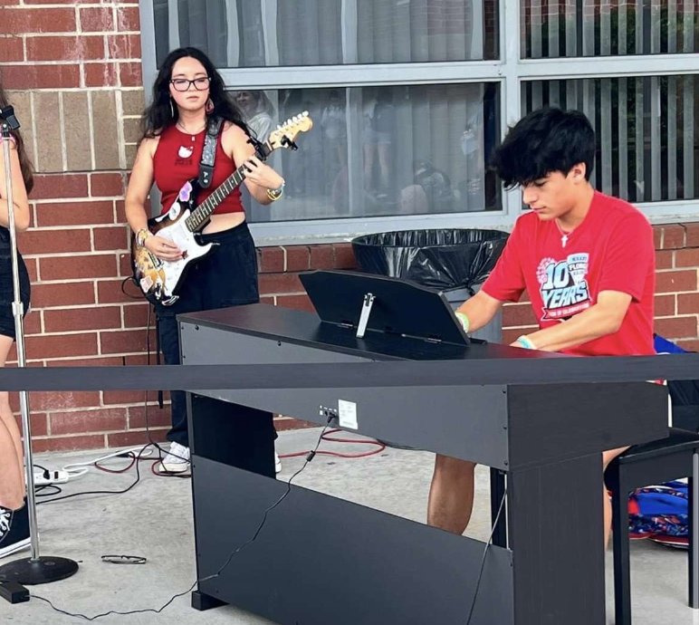 Leticia Carrasco (left) and Adrian Davila-Guzman (right) preform at the opening ceremony for the month. The ceremony was held Sept. 16 during lunch.