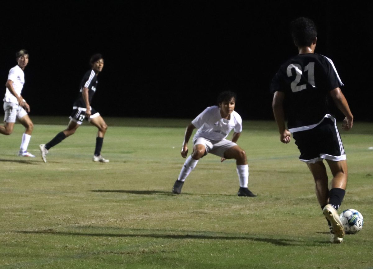 Junior Kaden De La Rosa gears up to pass the ball to senior Leonardo Garay. De La Rosa defended the goal, while Garay served as a forward on the team.