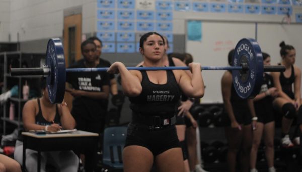 Sophomore Isabella Cruz lifts 115 pounds during the matchup. Several members including Cruz scored personal high scores during the match against Lake Mary.