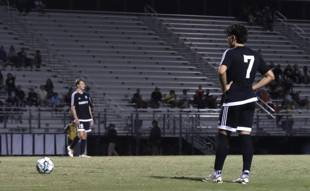 Senior Vincent Talo prepares to kick the ball during a soccer match. Currently, the boys have a 2-0-2 record.