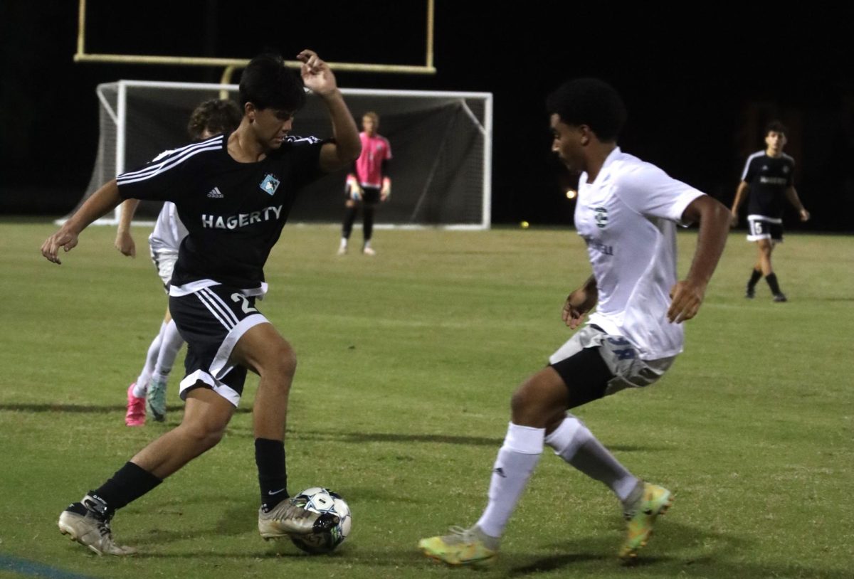 Junior Kaden De La Rosa evades two opponent players. The game against Lake Howell was the season opener.