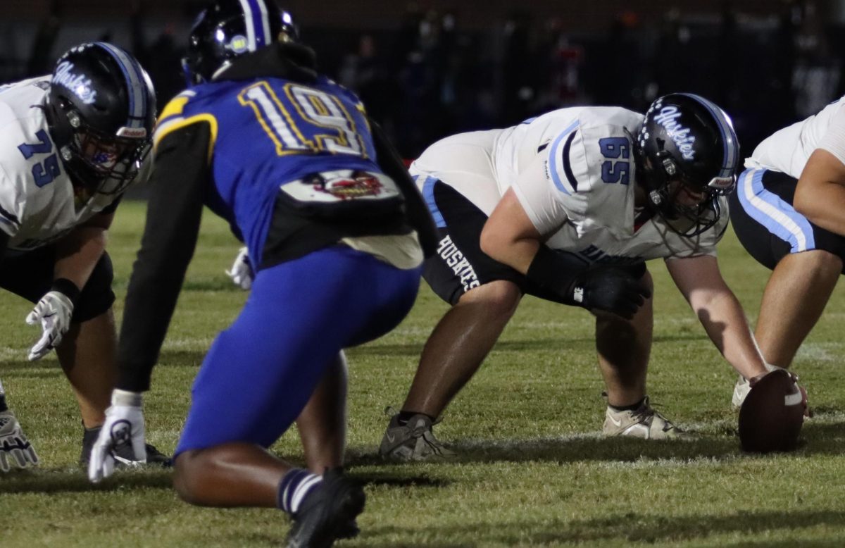 Center David Pollack prepares to snap the ball in the first half of the football game against Lyman. 