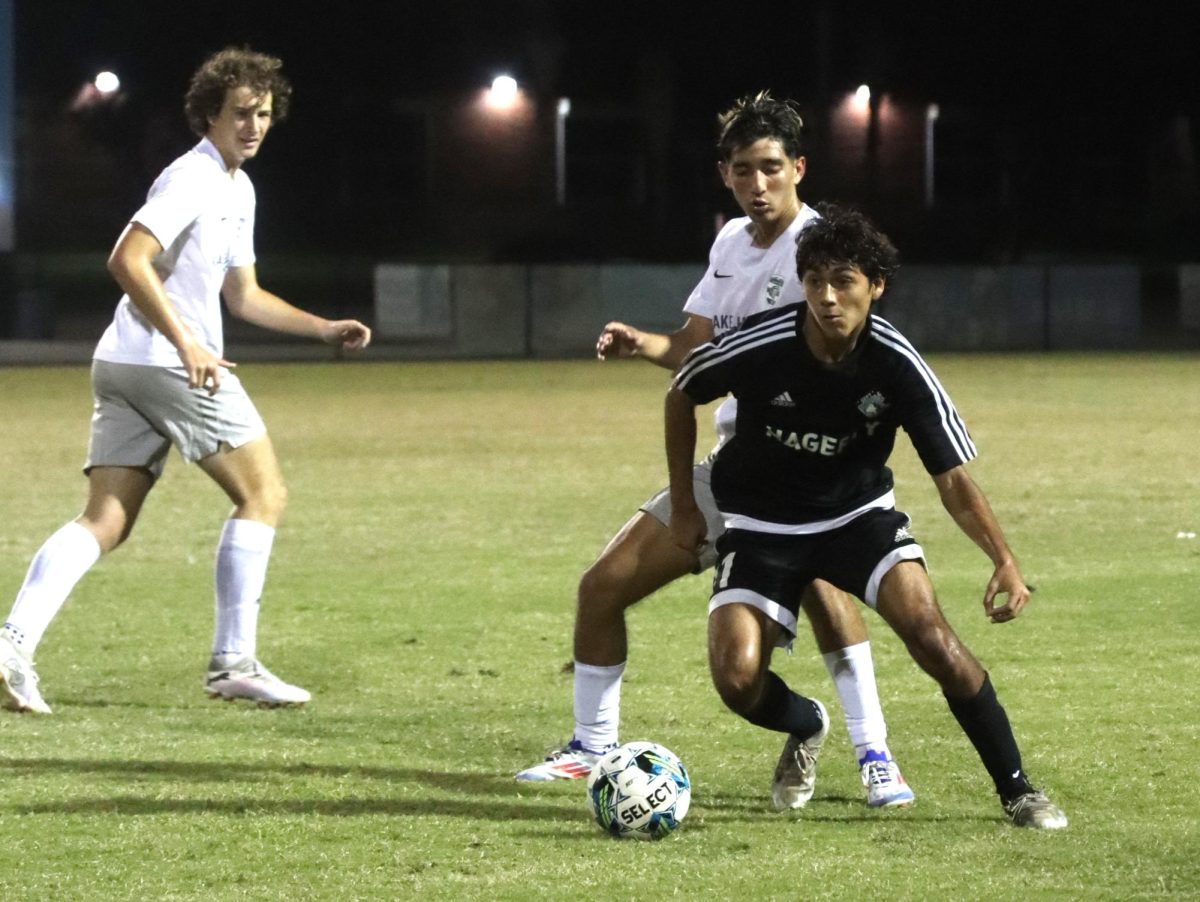 Senior Leonardo Garay strides after the ball during the game. Garay scored one of four goals in the game.